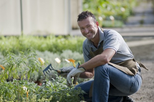 A well-kept Gunnersbury garden with healthy grass and seasonal planting